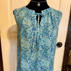 Sleeveless green and blue blouse